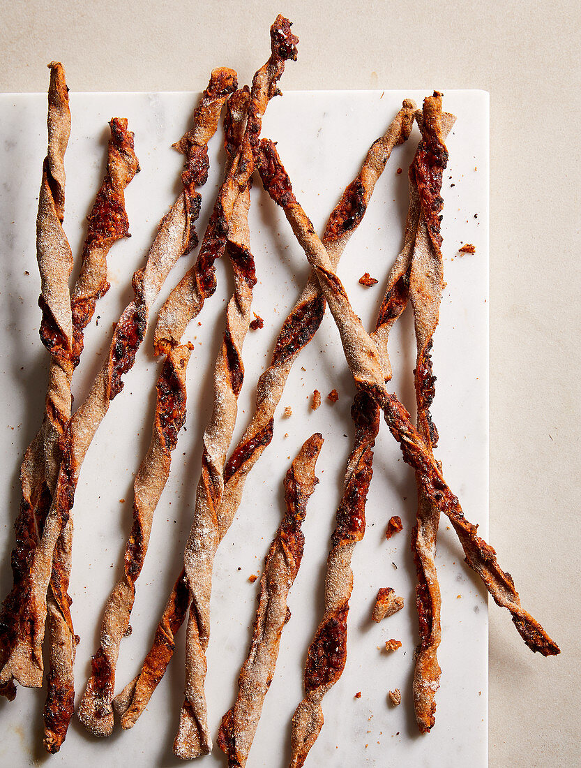 Twisted pizza sticks made with tomatoes, cheese and herbs