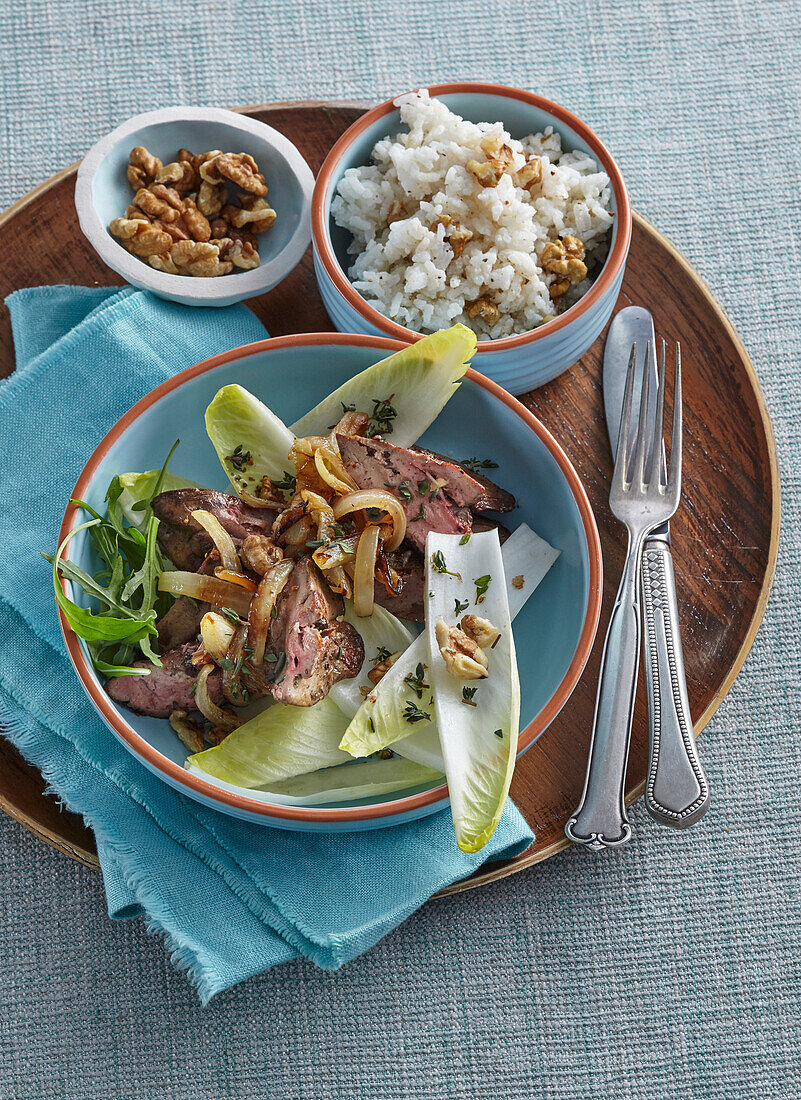 Poutry liver with chicory salad and rice