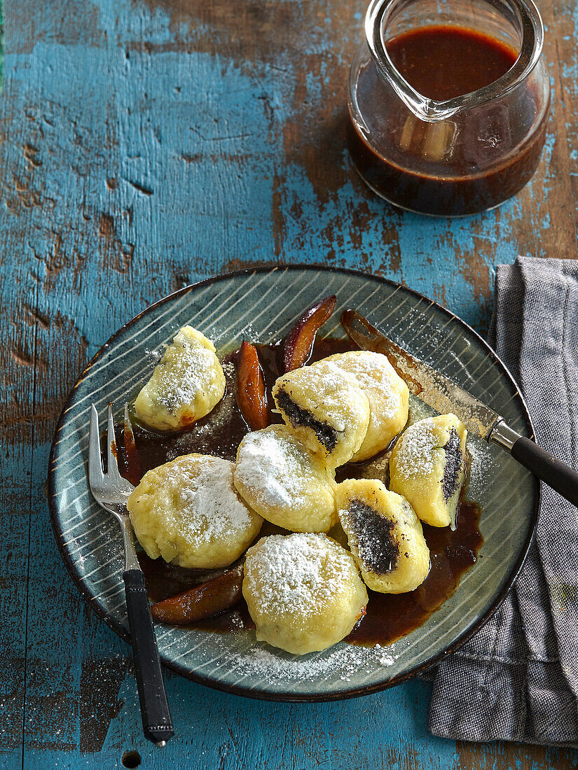 Potato dumplings with poppy seed stuffing and damsoncheese sauce