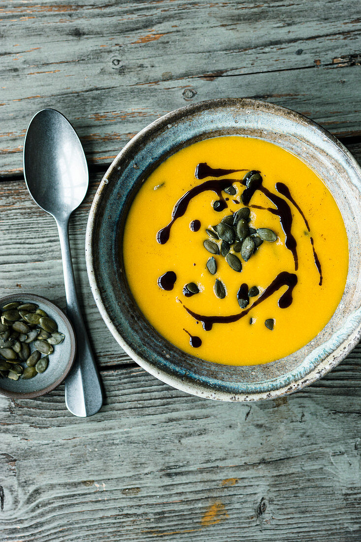 Vegan pumpkin and apple soup with coconut milk and ginger