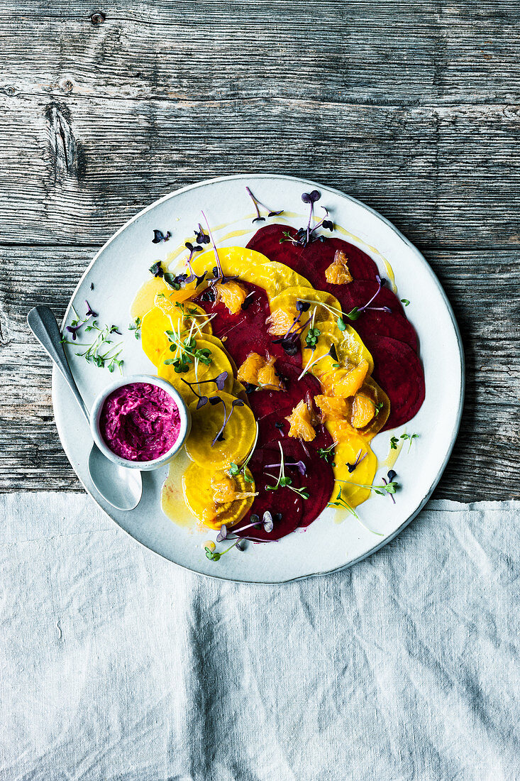 Beetroot carpaccio with and orange and olive oil emulsion and beetroot quark