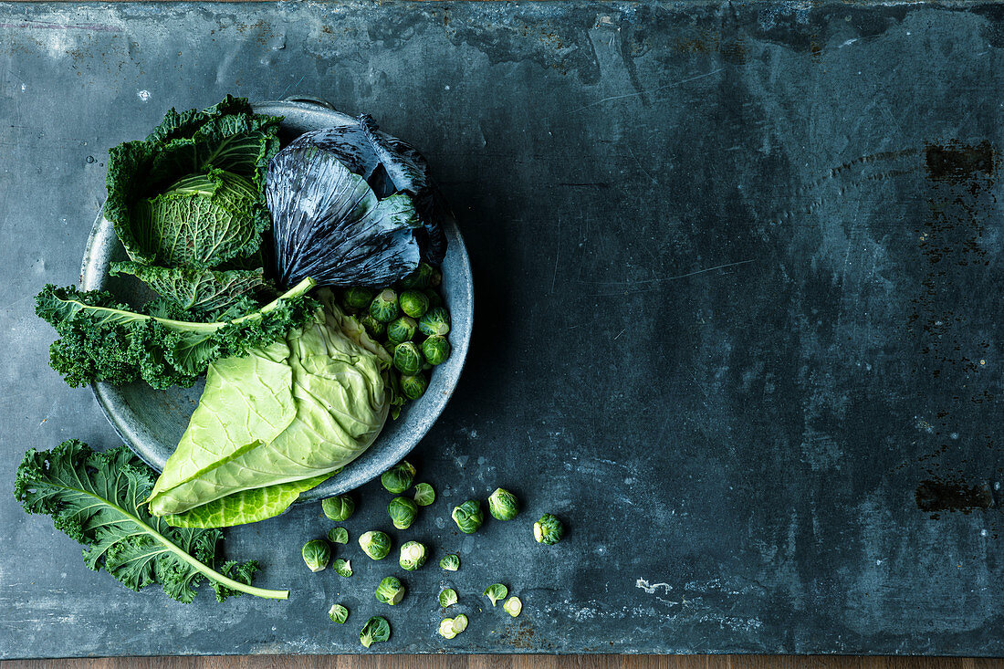 An arrangement of cabbage – red cabbage, savoy cabbage, freekeh, pointed cabbage, Brussels sprouts