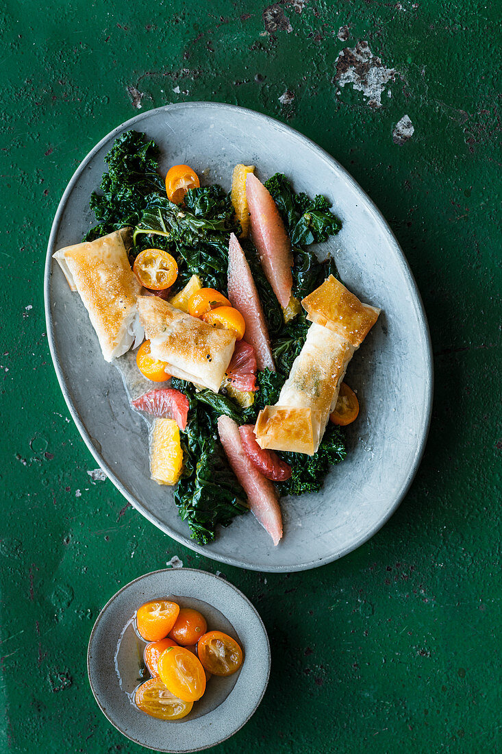 Kale salad with citrus fruit and cod in brik pastry