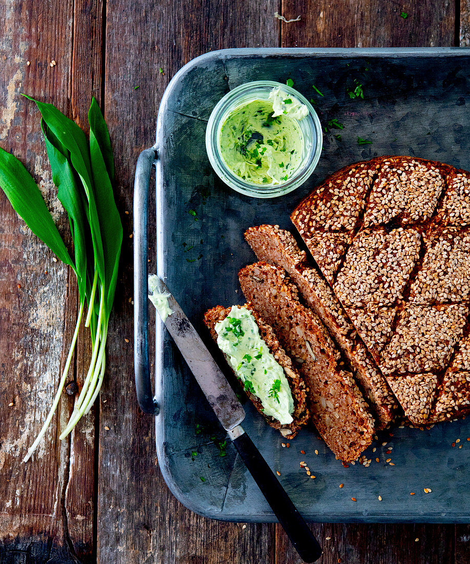 Whole grain sesame bread with wild garlic butter