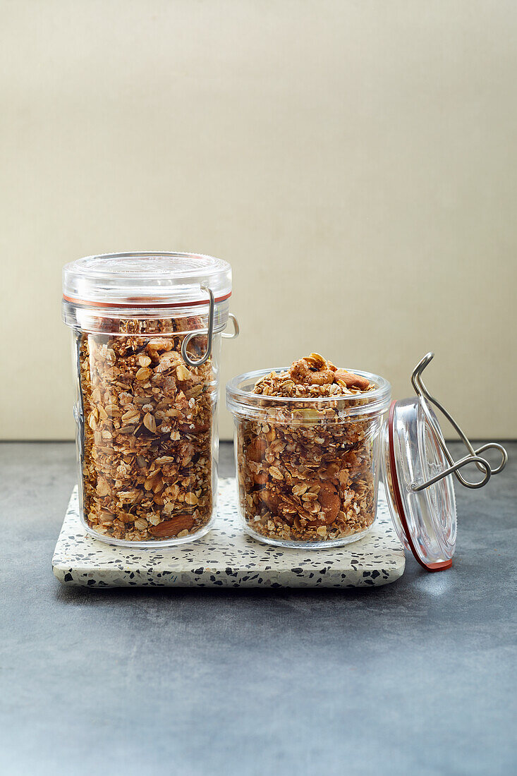 Homemade pan-fried amaranth granola in storage jars