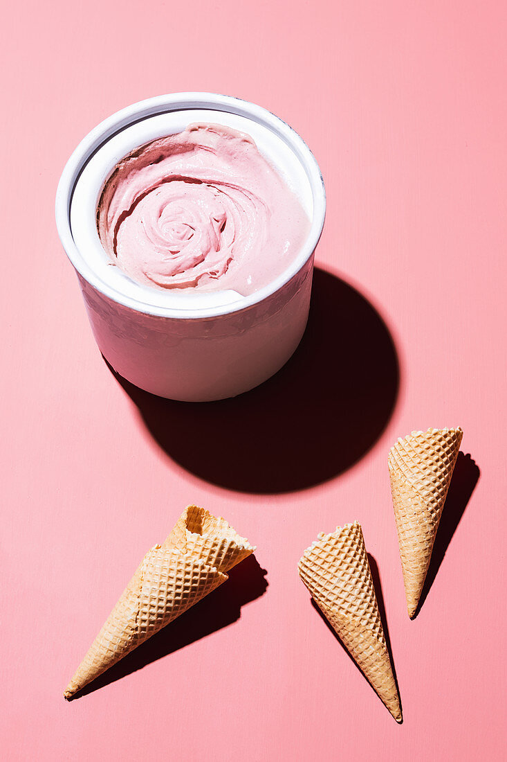 Strawberry prosecco ice cream and empty ice cream cones