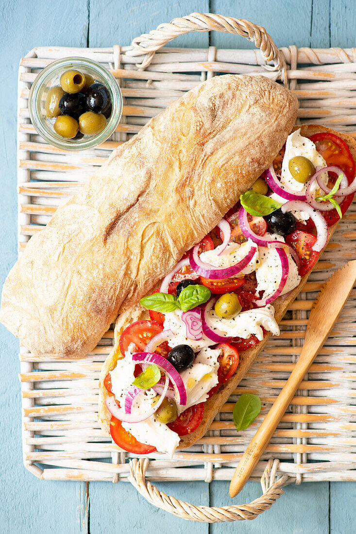 Ciabatta with tomatoes, mozzarella and olives