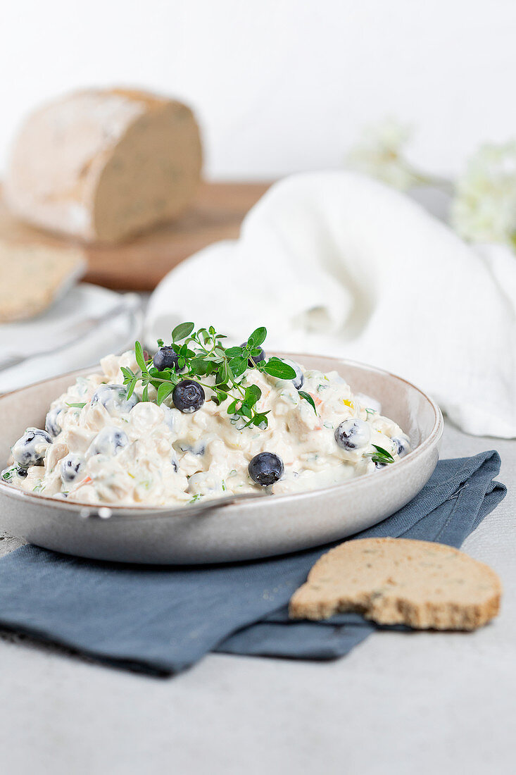 Chicken salad with leek, carrots, blueberries and mayonnaise