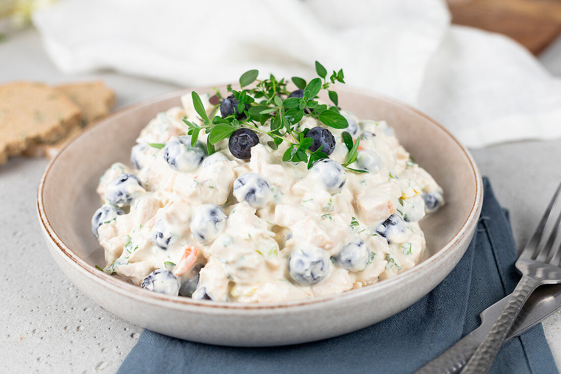 Chicken salad with leek, carrots, blueberries and mayonnaise