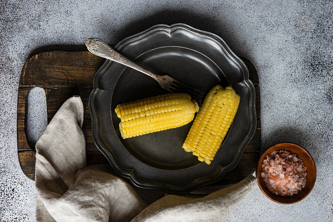 Boiled corn vegetable with pink salt