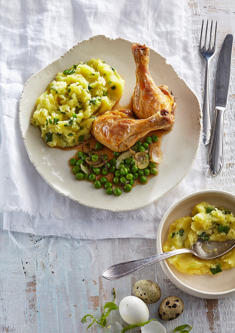 Young roasted chicken with mashed potatoes and peas