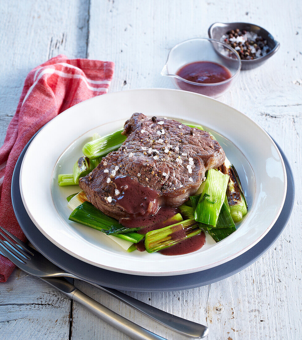 Beef steak with red wine sauce and leek