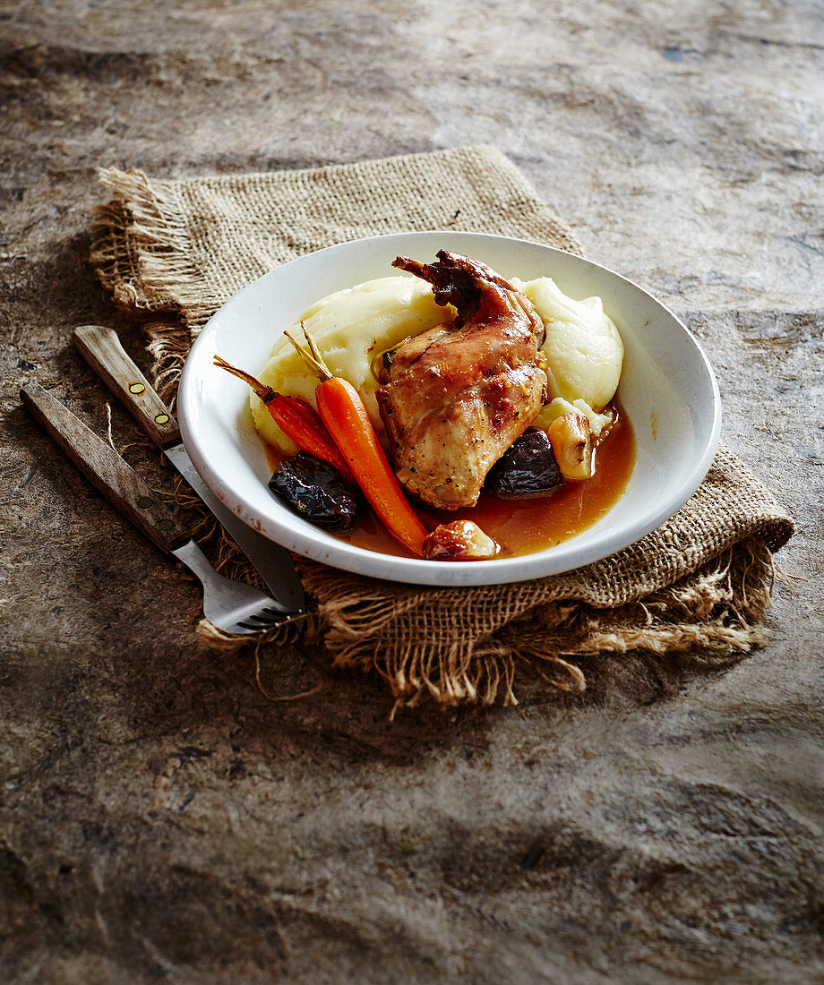Braised rabbit with prunes and white wine