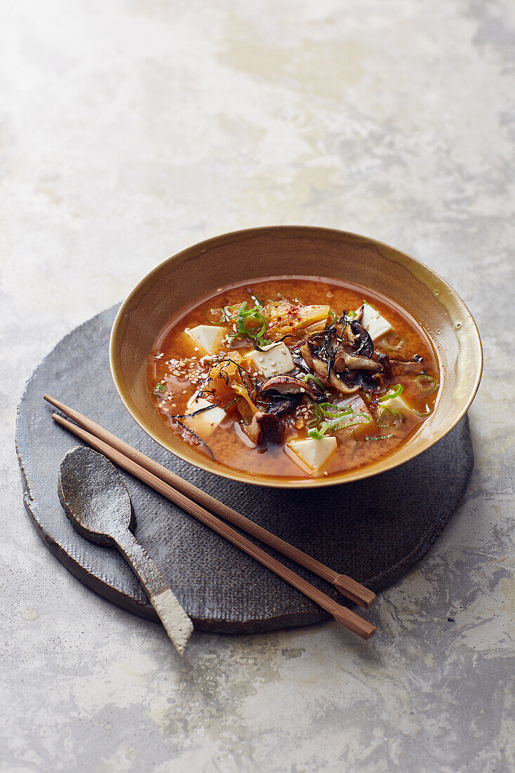 Vegan kimchi soup with silken tofu