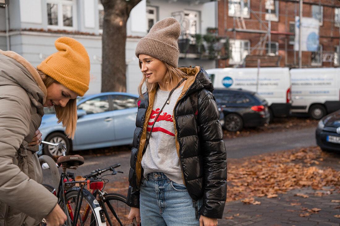 Two women on autumn street