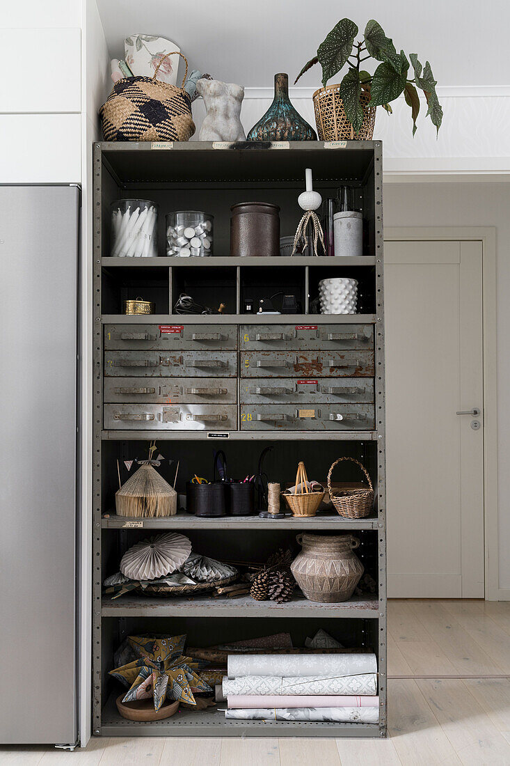 Vintage industrial cupboard with decorative utensils