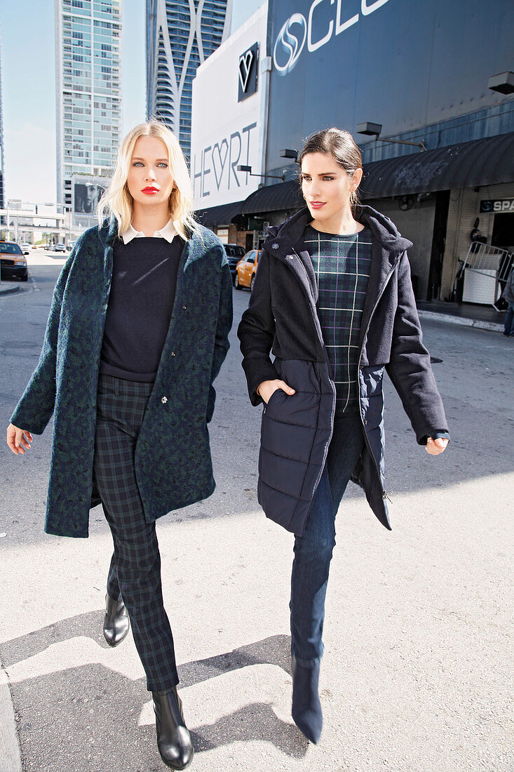 Two young women wearing winter outfits in shades of blue