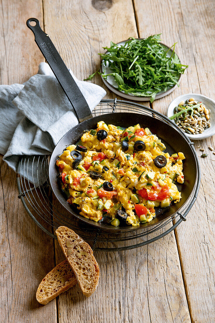 Mediterranean scramble eggs with squash, black olives, and tomatoes
