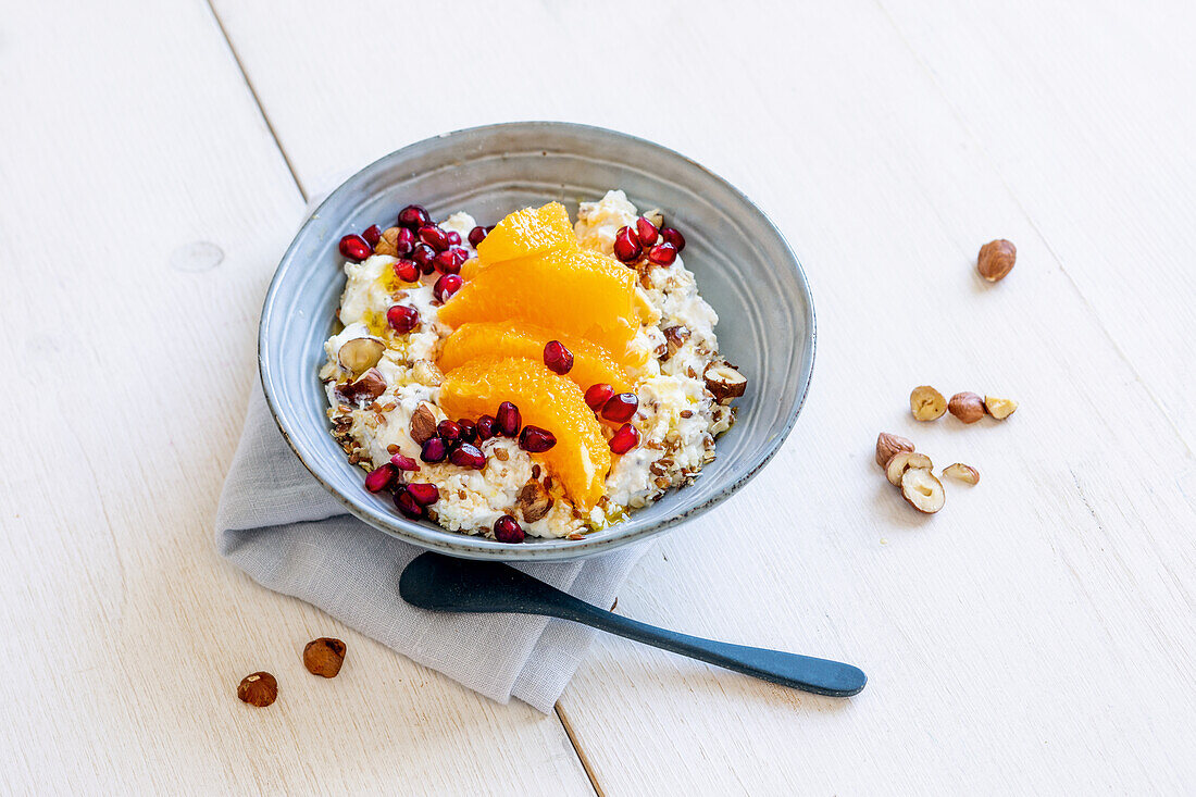Vegan orange yogurt with oranges and pomegranate seeds