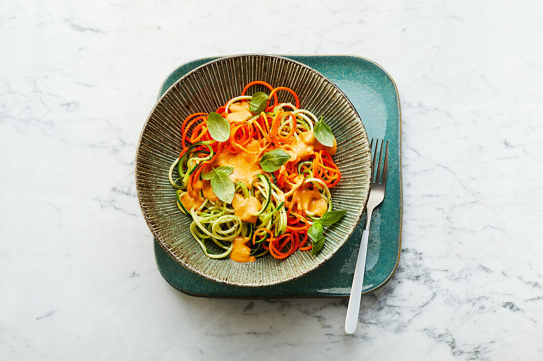 Vegan vegetable zoodles with pepper-almond sauce