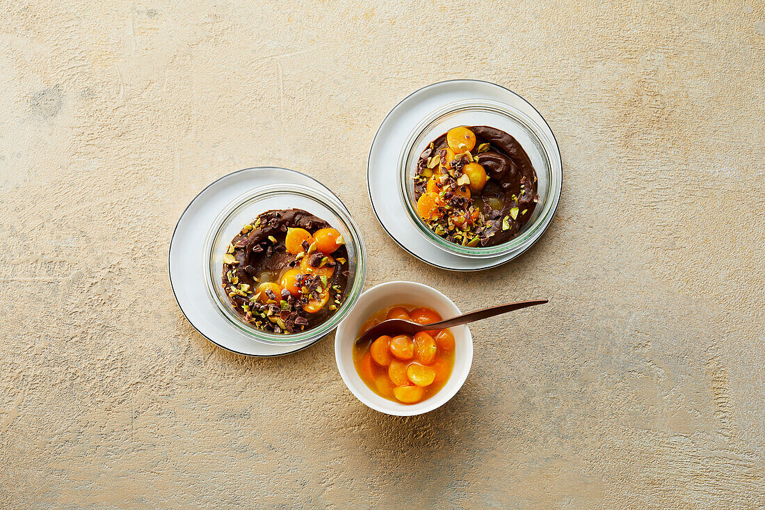 Avocado-chocolate mousse with physalis and pistachios