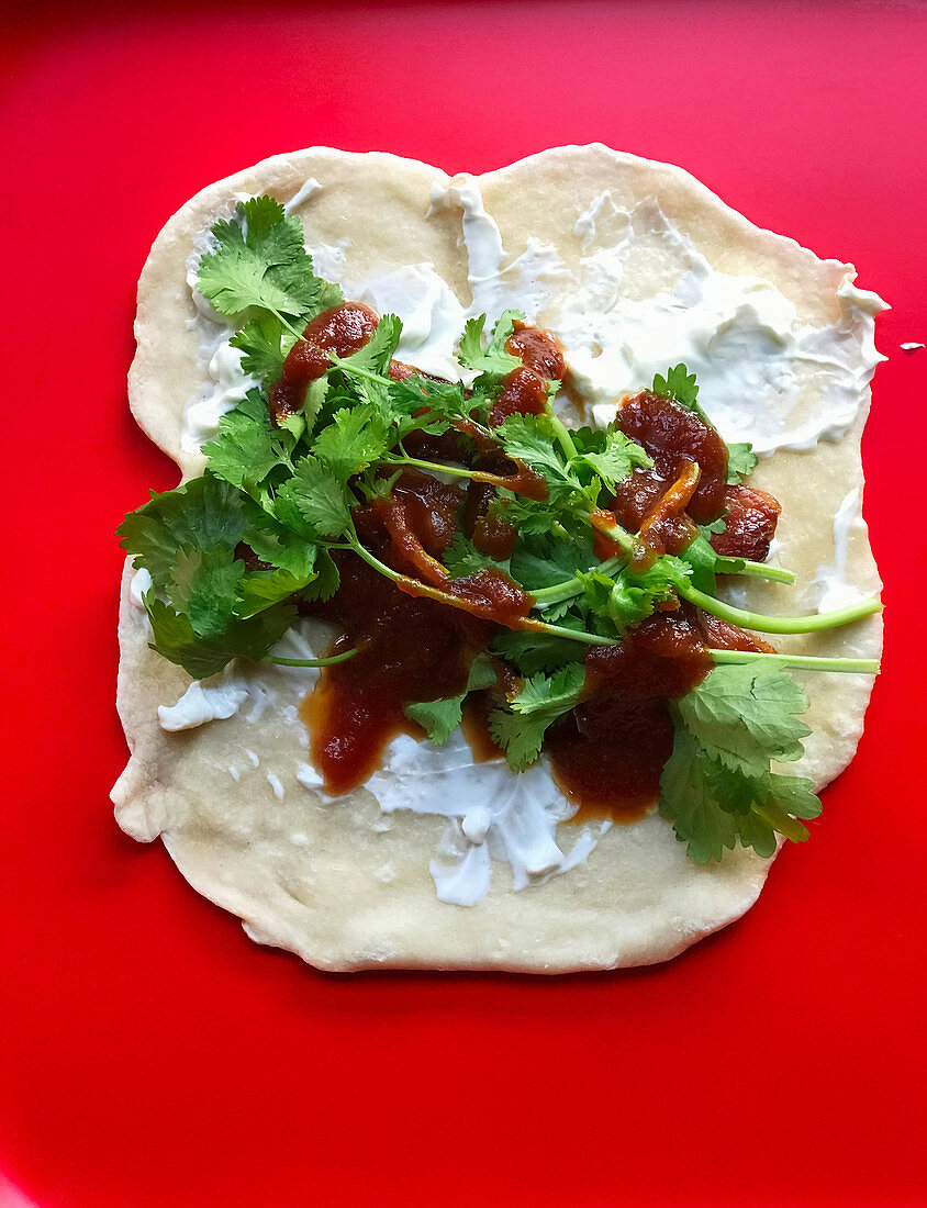 Naan bread with bacon, yoghurt and chilli jam