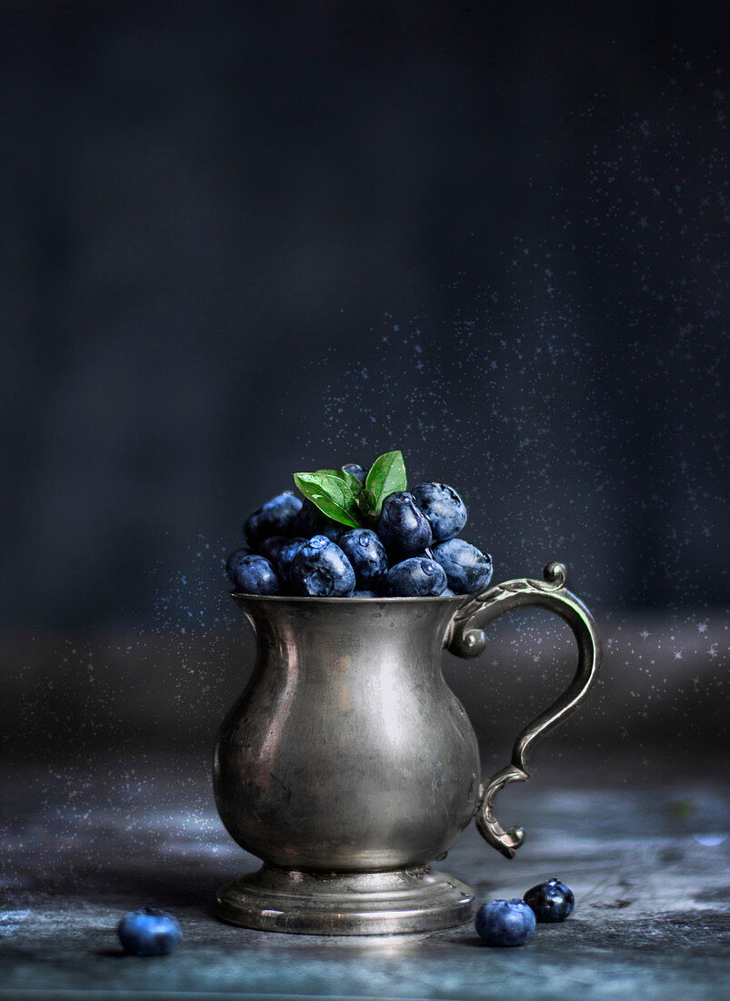 Blueberries in a vintage silver pot