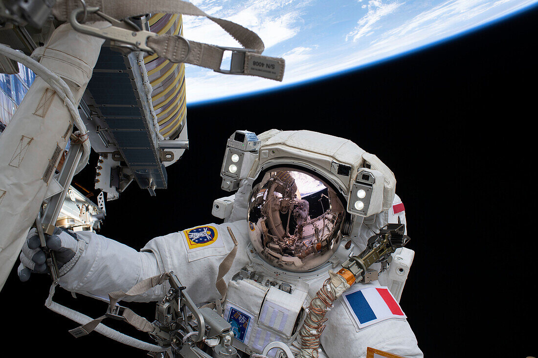 Astronaut Thomas Pesquet installing solar arrays on the ISS