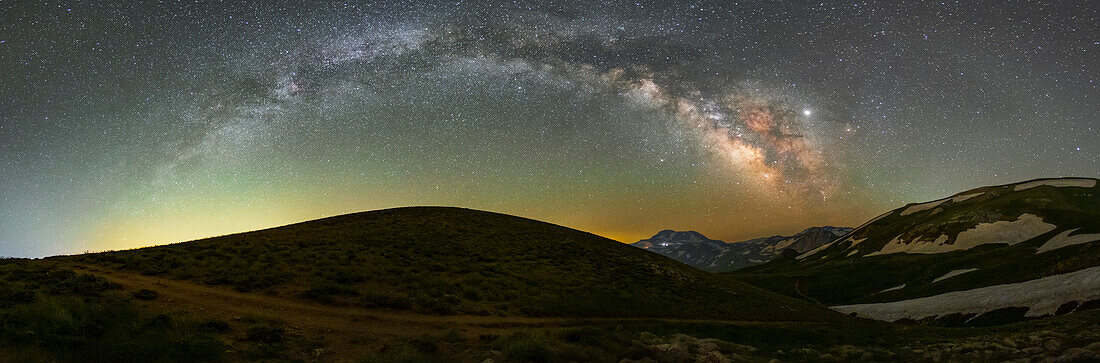 Milky Way arch over mountains