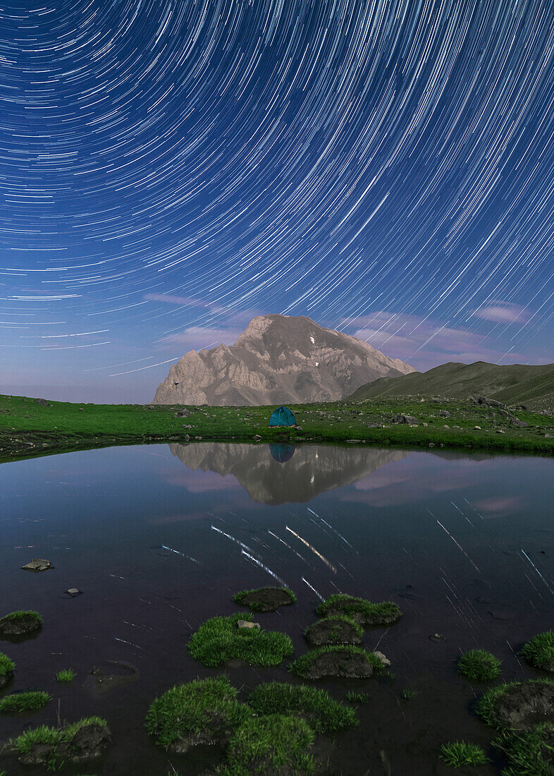 Star trails over Alpine lake, Alborz Mountains, Iran