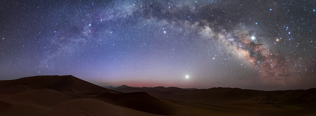 Milky Way arch over sand dunes, Lut desert, Iran
