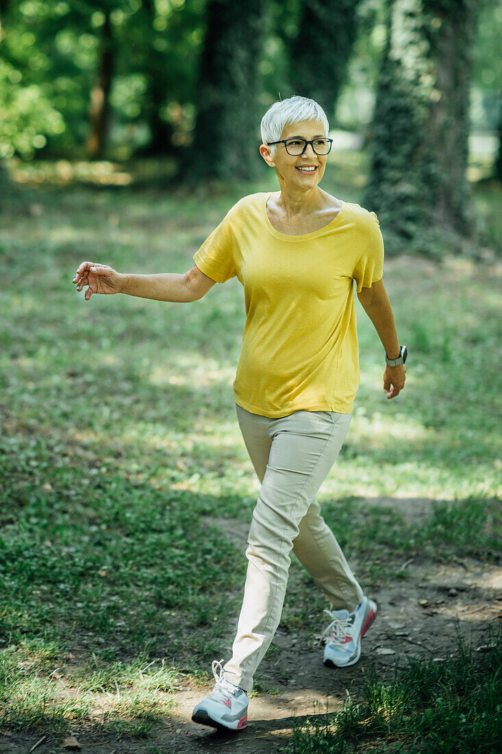 Senior woman enjoying walking in nature