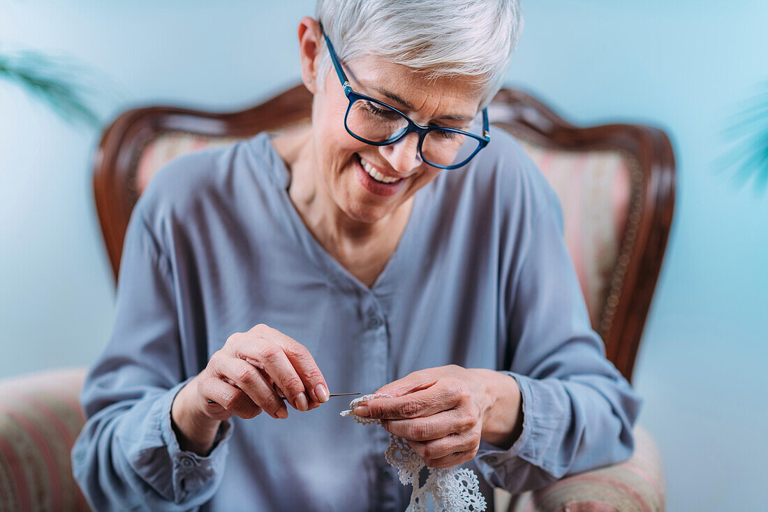 Senior woman doing crocheting