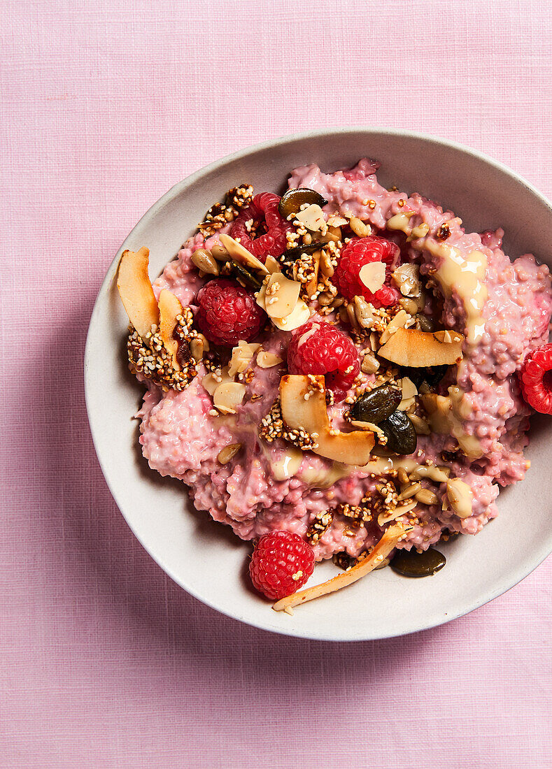 Millet porridge with raspberries and coconut chips