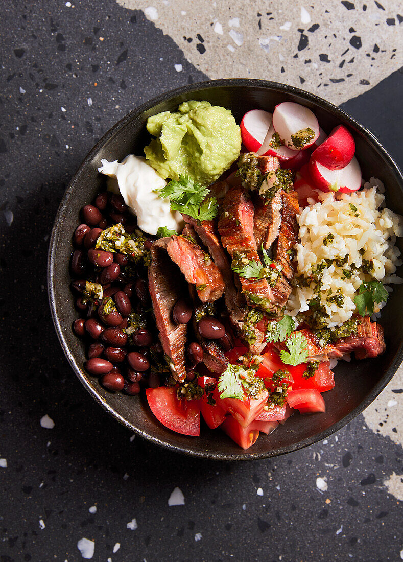 Steak bowl with chimichurri and black beans