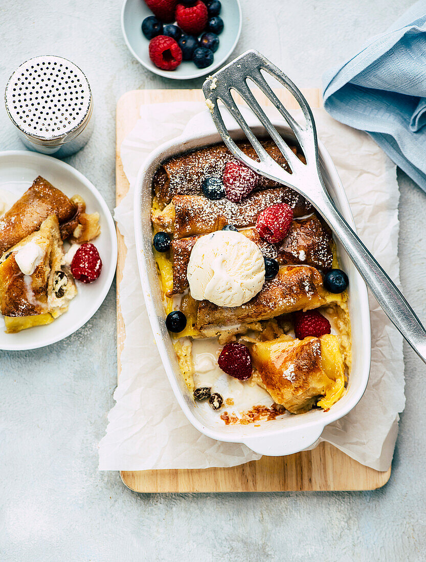 Pancake casserole with berries and ice cream