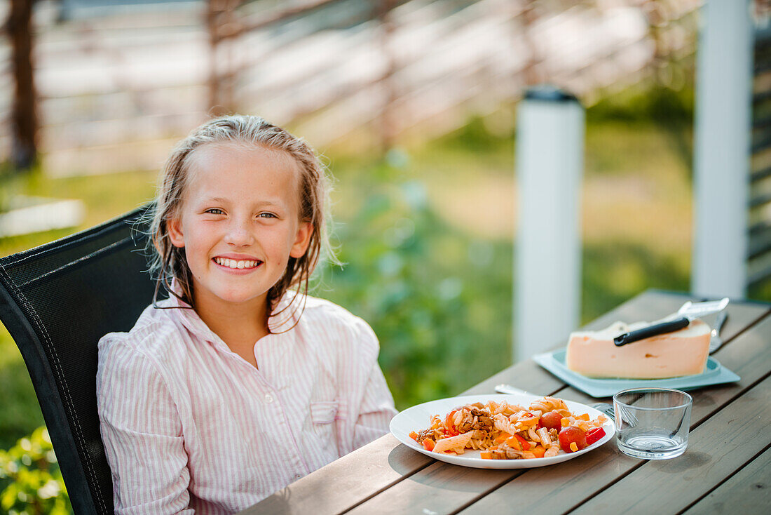 Smiling girl at table