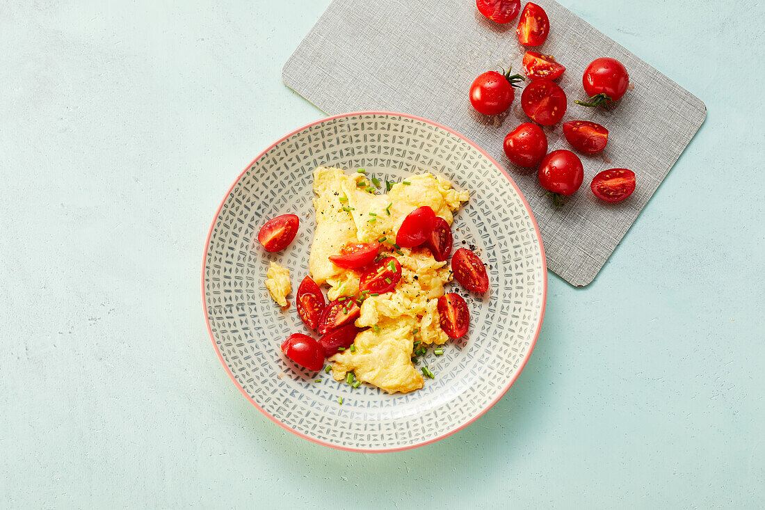 Scrambled eggs with tomato and cheese