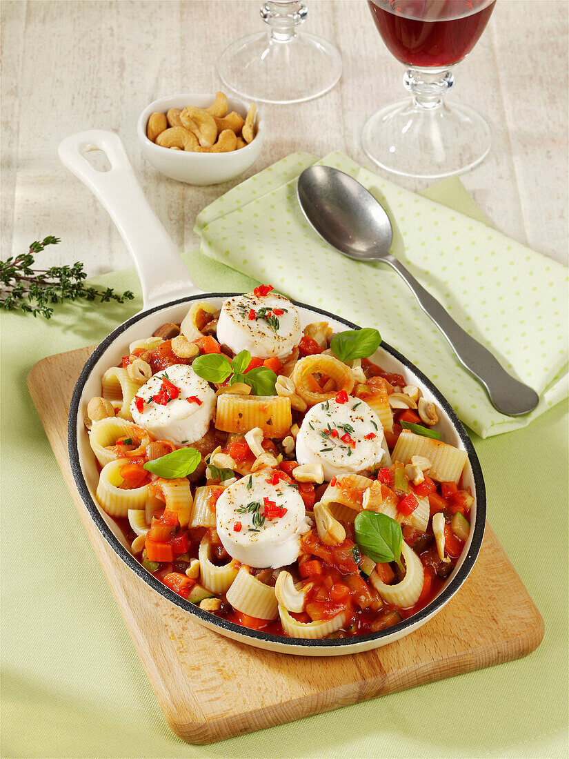 Calamarata pasta with vegetable sugo and goat's cheese