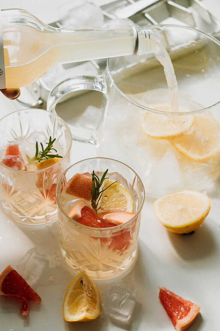 Pouring lemonade into jug