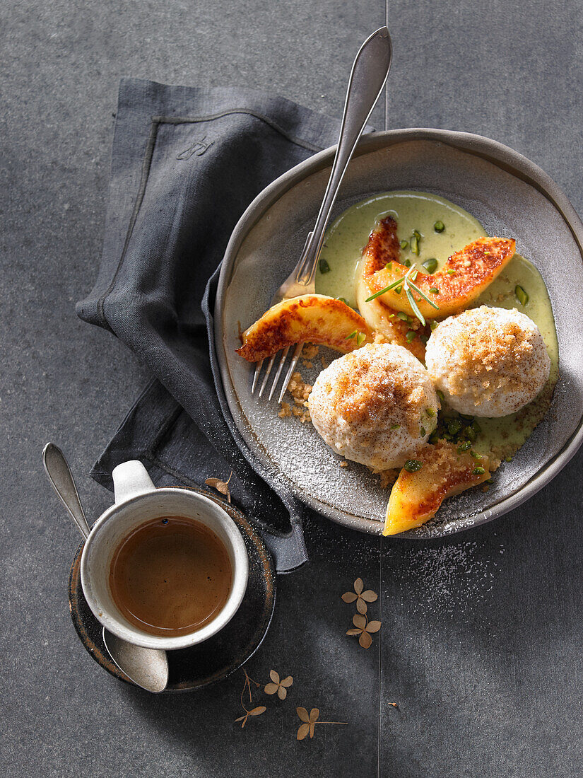 Quark dumplings with caramel quince and a pistachio-and-rosemary sauce