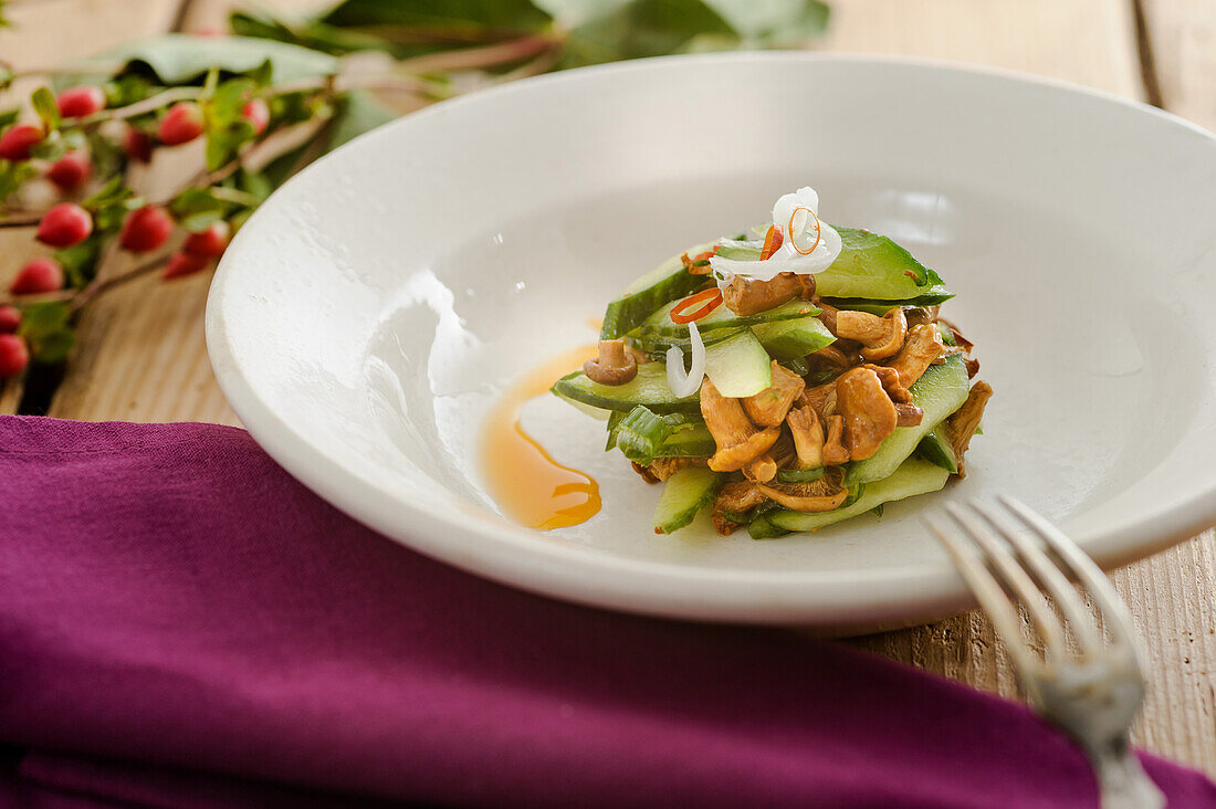 Chanterelle salad with cucumber and poppy seed oil