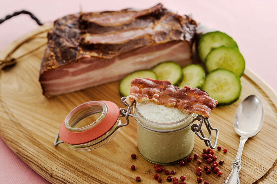 Chilled cucumber gazpacho with poppy seed oil and bacon strips