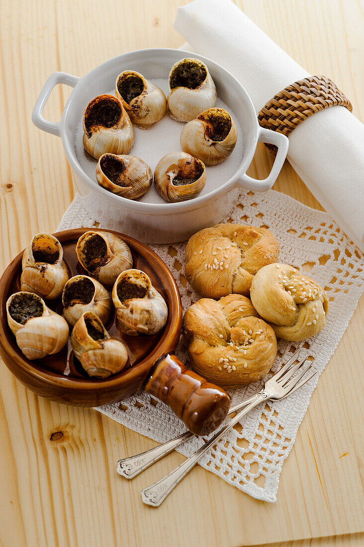 Vineyard snails with poppy seed butter and Sesame seed bread roll