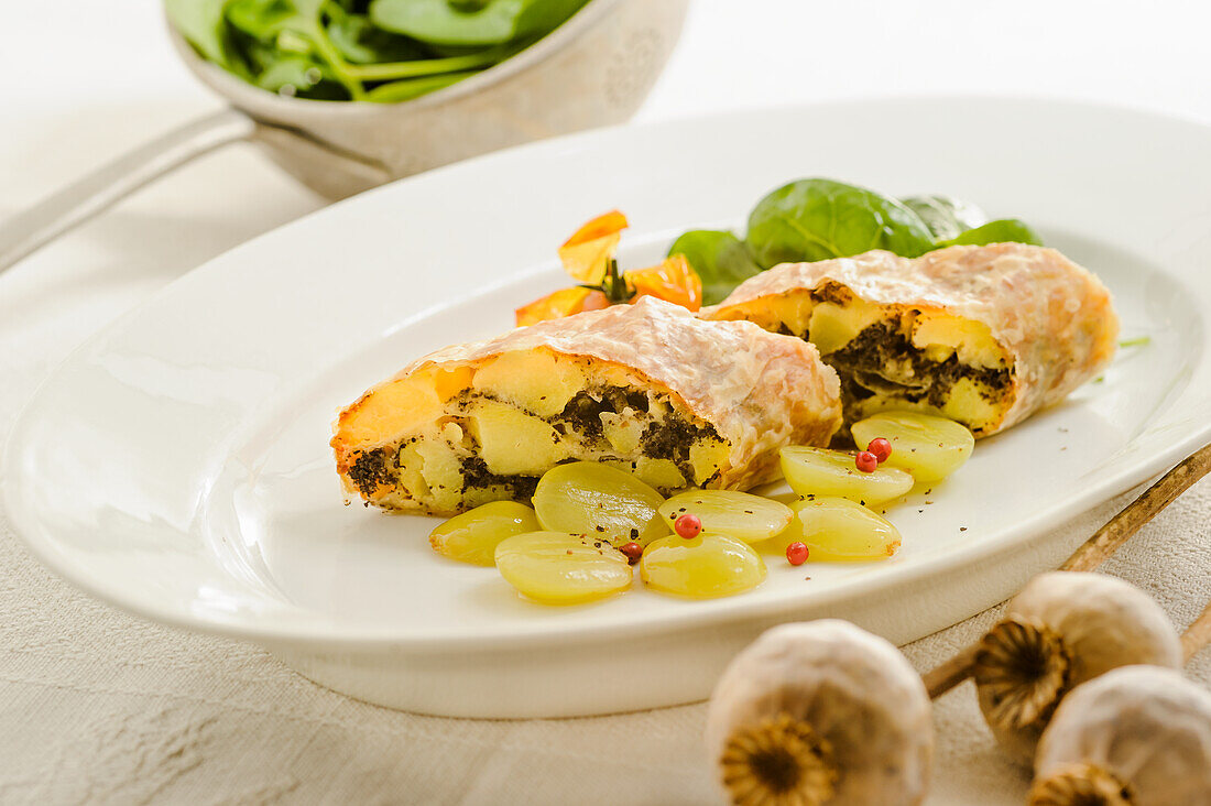 Potato-poppy seed strudel with grapes