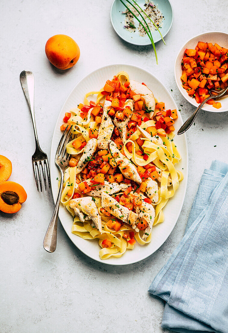Grilled and sliced Chicken breast with apricot salsa and tagliatelle