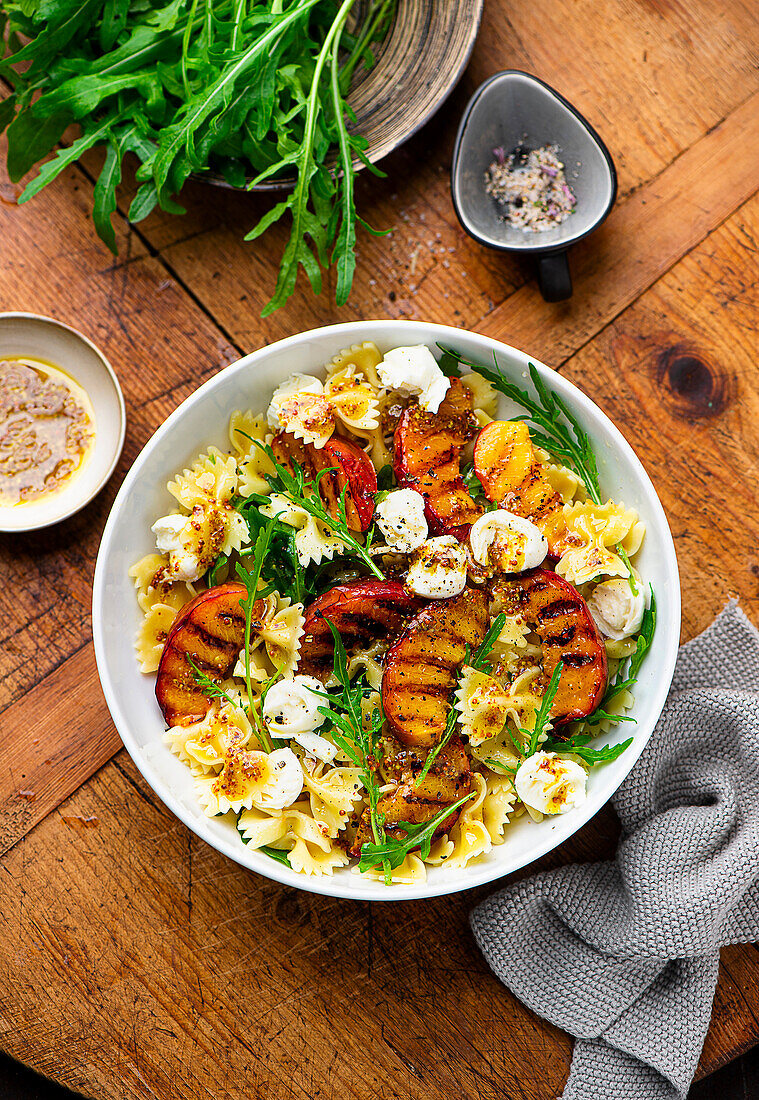 Summer pasta salad with grilled nectarine and mozzarella cheese