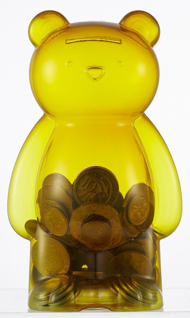 Teddy bear money box, half filled