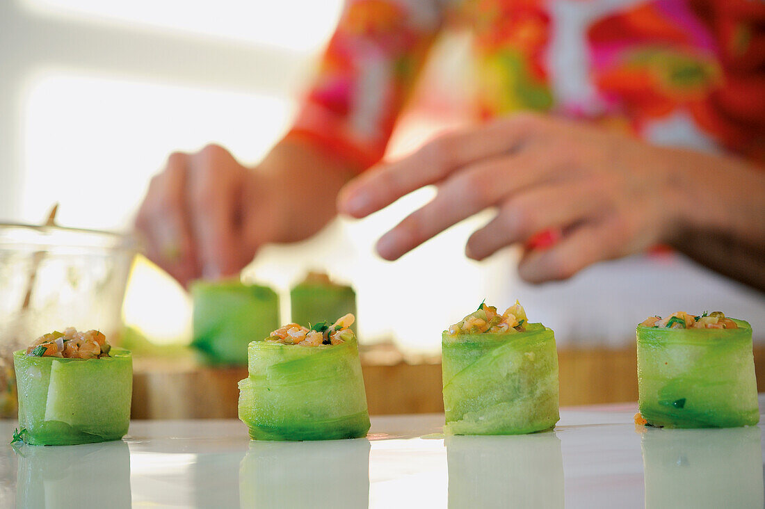 Cucumber canapées being made