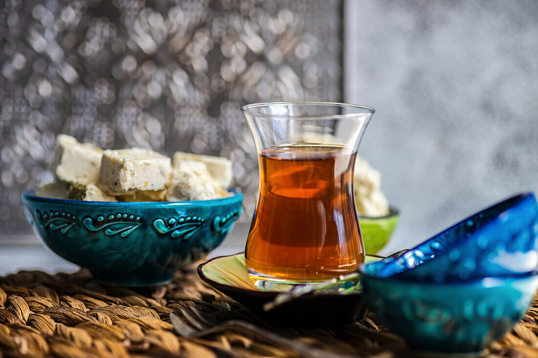 Turkish tea and dessert halva served in traditional style